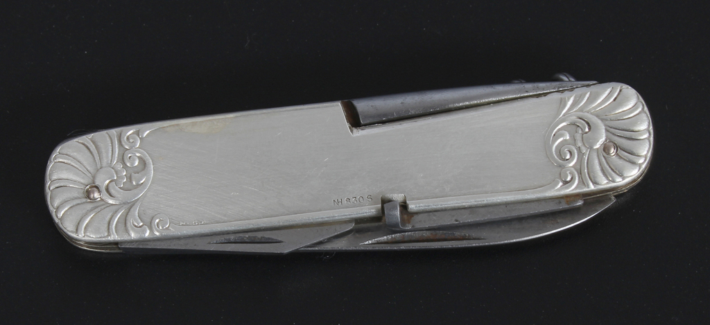 A knife with a silver case