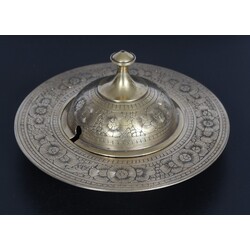 A metal container for incense