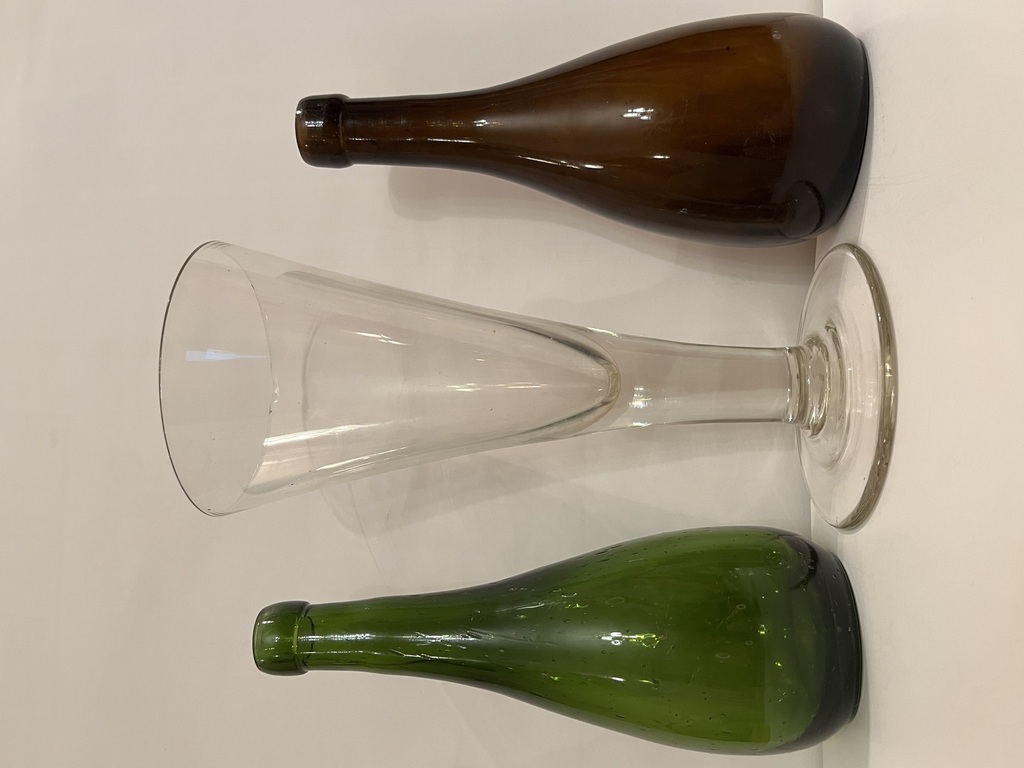 Beer bottles with a glass