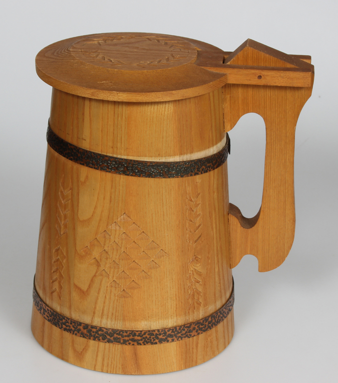 Large wooden beer mug with ornaments