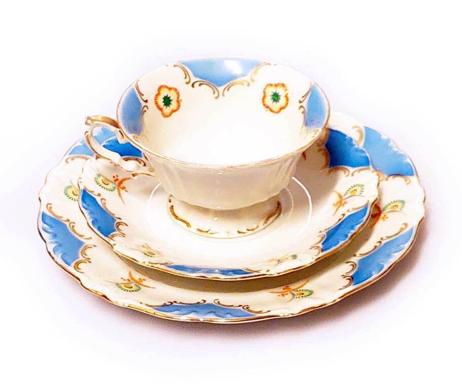 Painted Porcelain cup with two saucers