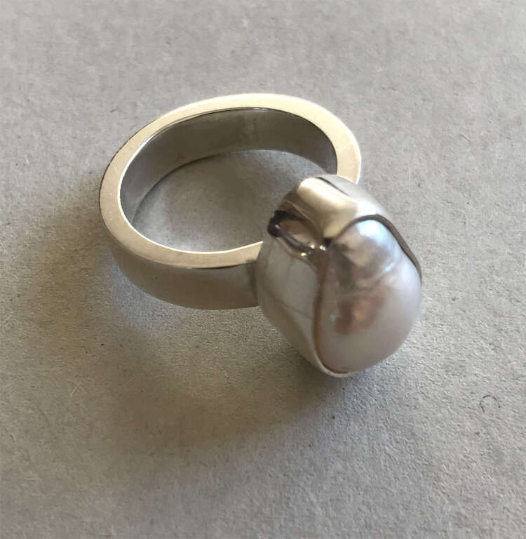 Silver ring with a pearl