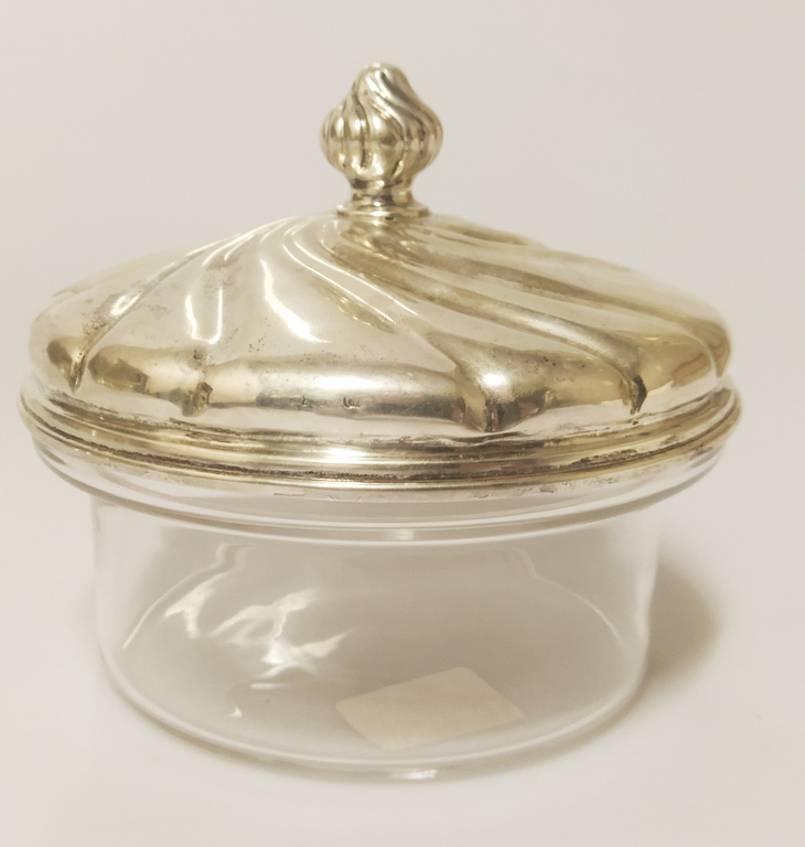 Glass container with silver lid