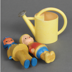 Two baby toys and a watering can