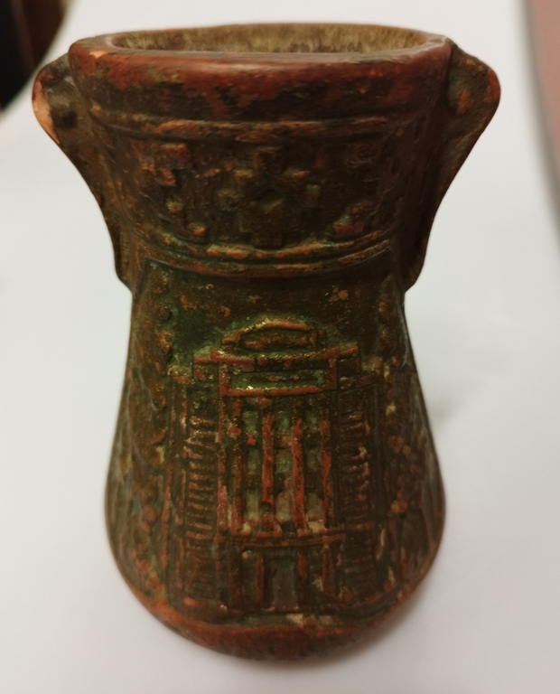Clay vase with city views