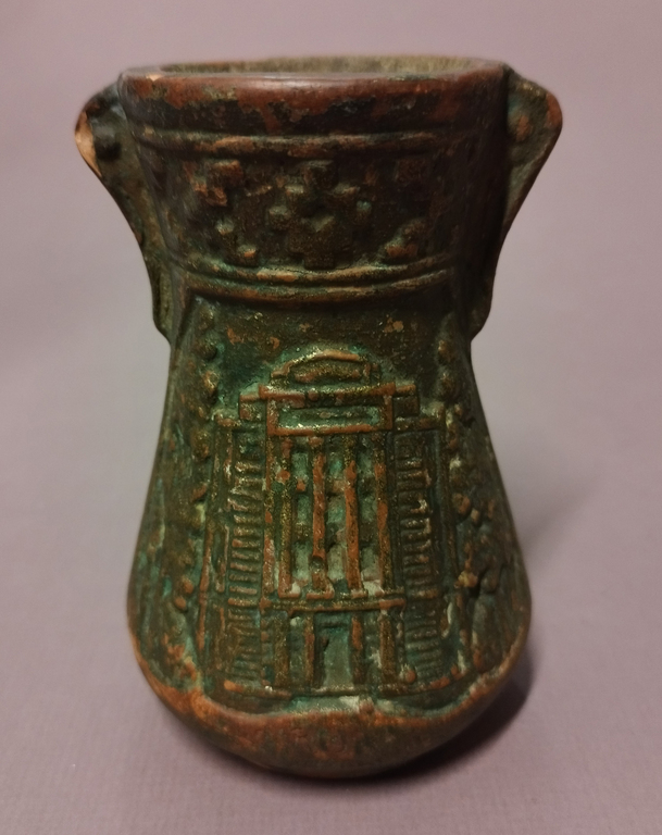 Clay vase with city views