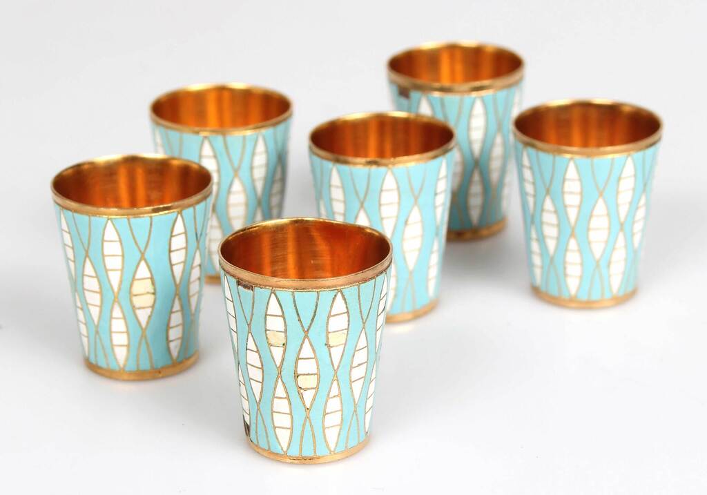 Metal cups with blue-white enamel
