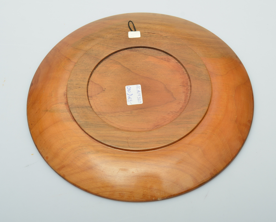 Decorative wooden plate with a floral motif
