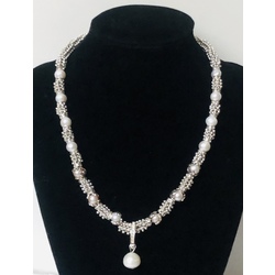 Akoya pearl necklace with silver and metal elements