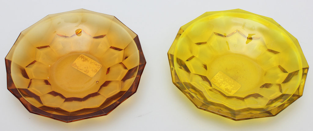 Two amber colored glass vessels