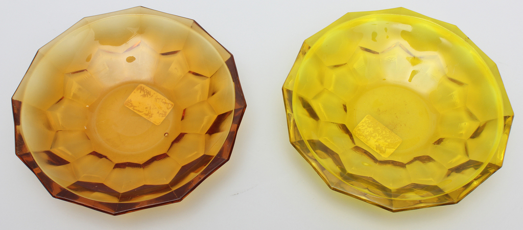 Two amber colored glass vessels