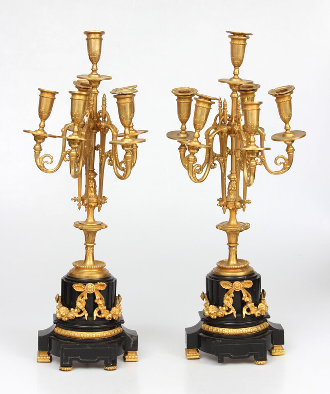 Bronze candlesticks with a stone base