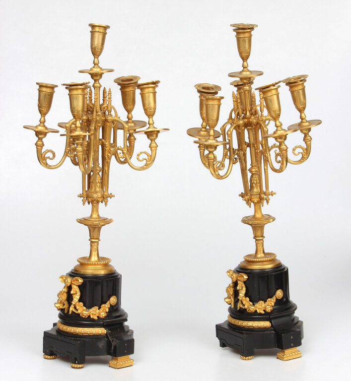 Bronze candlesticks with a stone base