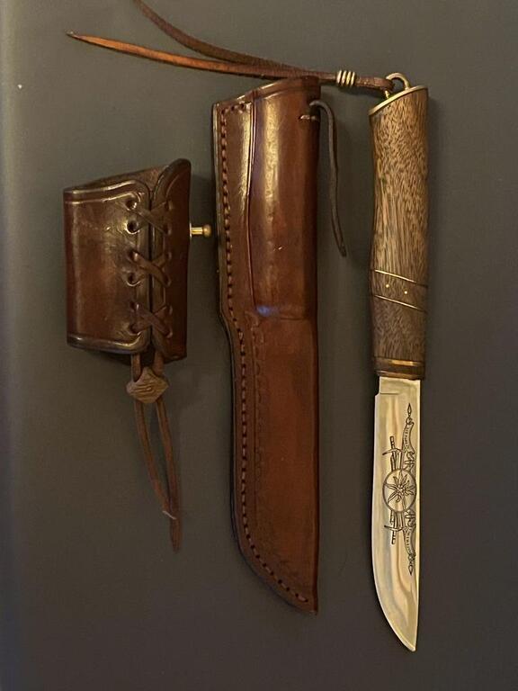 A knife with a leather sheath