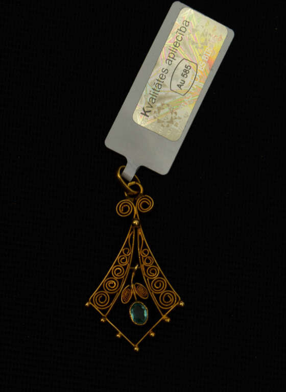 Filigree Art Nouveau gold pendant with a blue stone