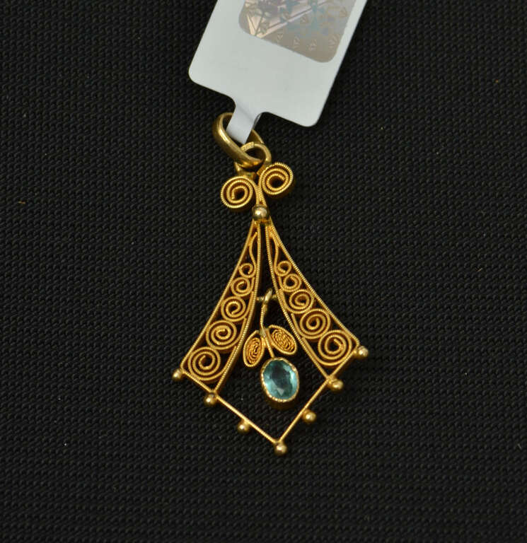 Filigree Art Nouveau gold pendant with a blue stone