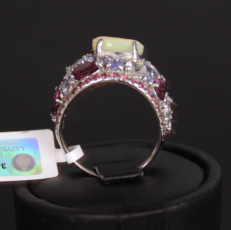 Silver ring with opal, tanzanites, beryls, rhodolites