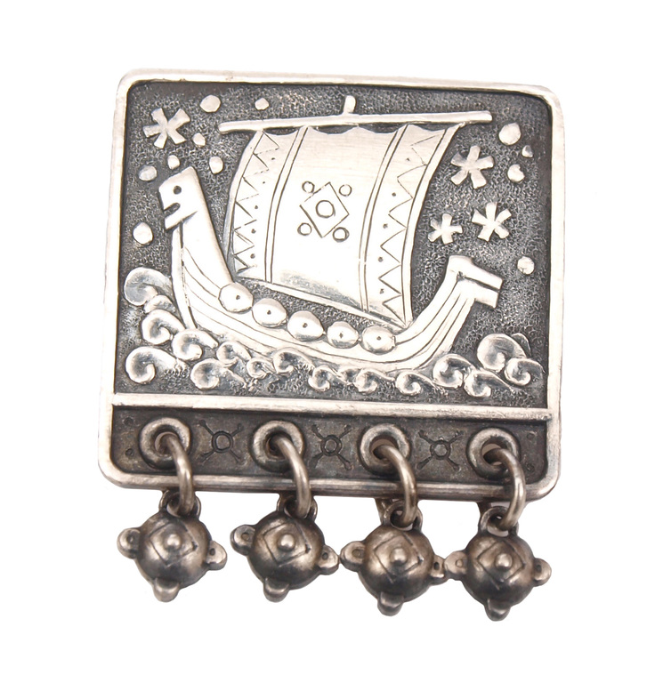 Silver brooch with sailing ship