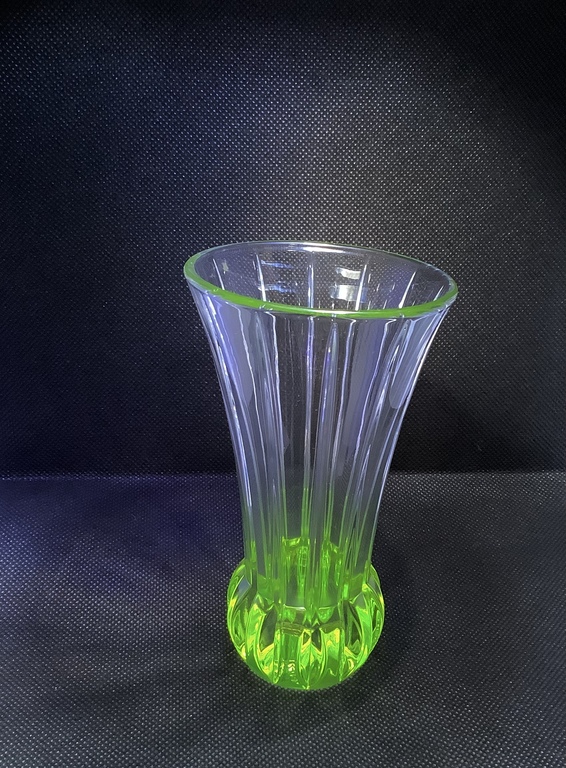 vase for Hyacinth, Bohemia, Uranium glass. Photo under ultraviolet. Lighting.