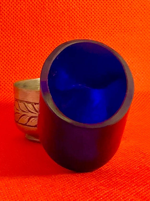 Salt cellar with cobalt glass insert. Slab carving. The adhesive is illegible.