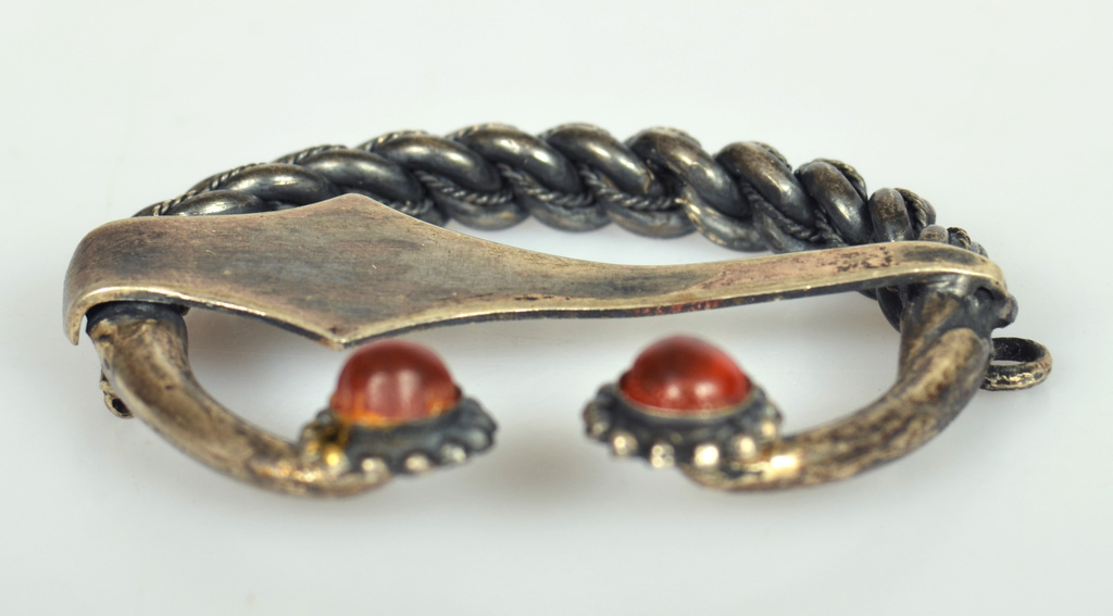Silver brooch with fused amber