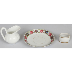 3 porcelain items - creamer, napkin holder, saucer