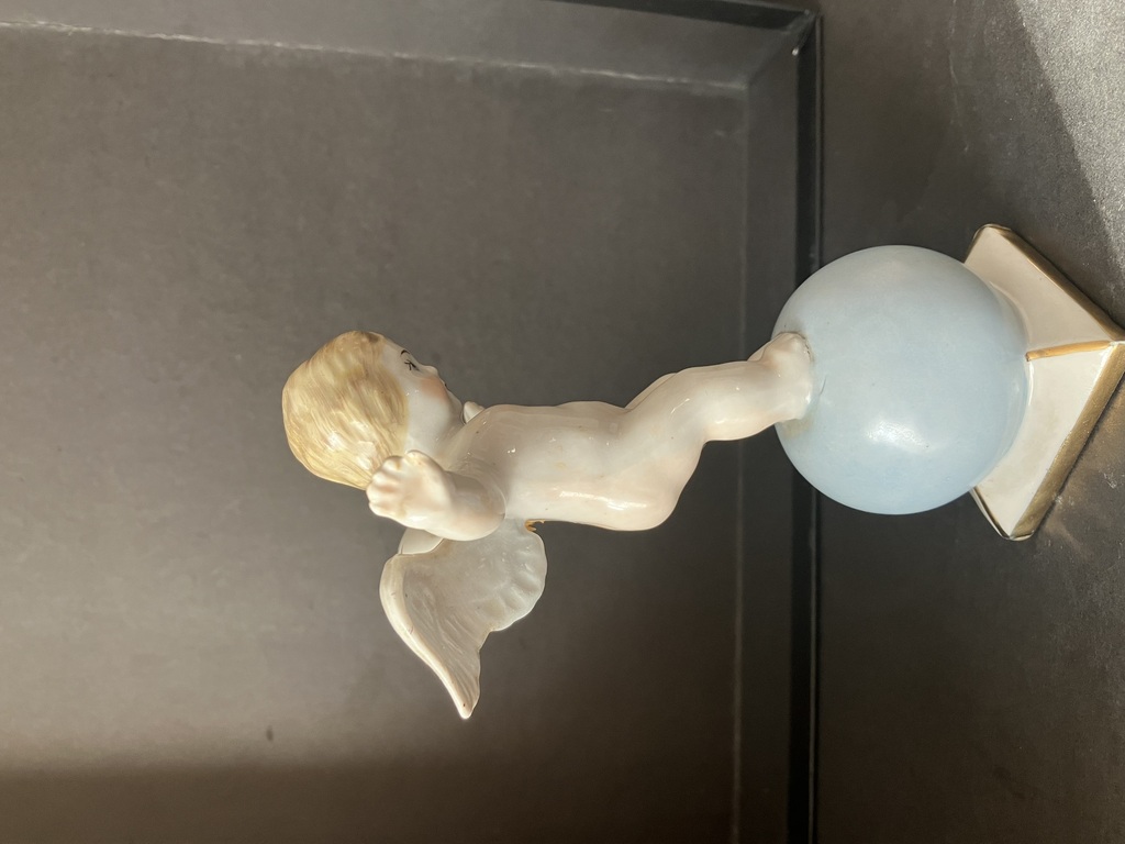 porcelain figurine angel on the ball