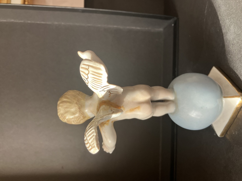 porcelain figurine angel on the ball