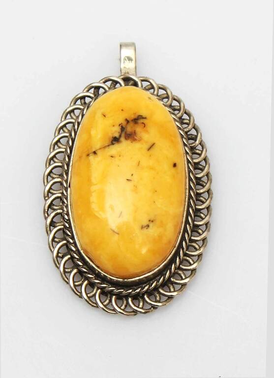 Amber pendant in a silver frame