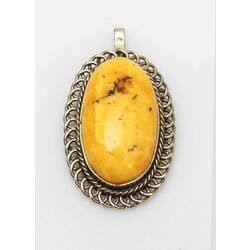 Amber pendant in a silver frame