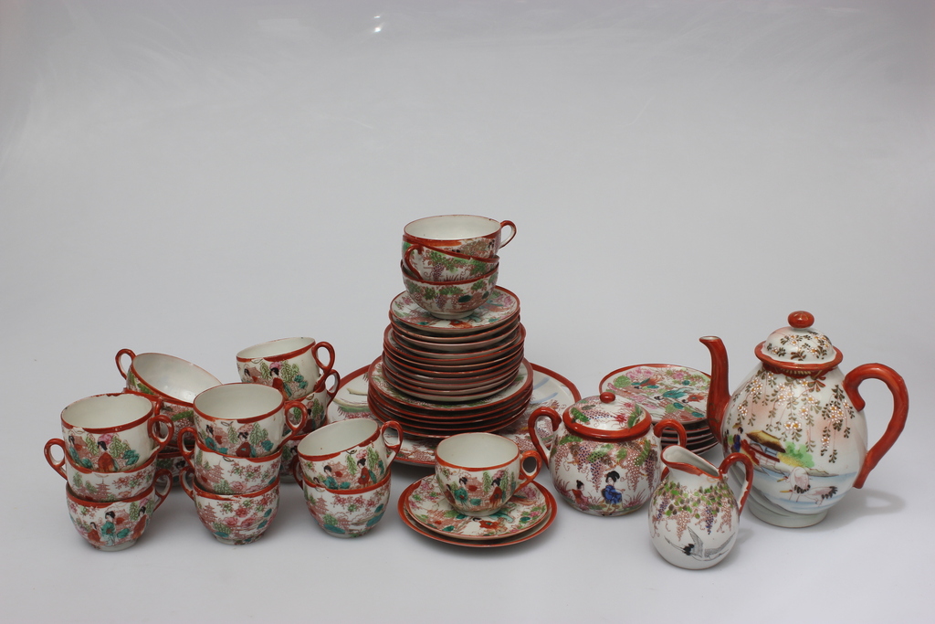 An incomplete porcelain service with a Japanese motif