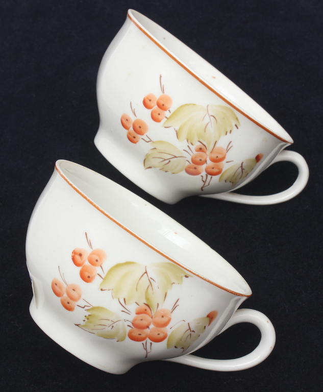 Painted porcelain cups and saucers (2 pcs.)