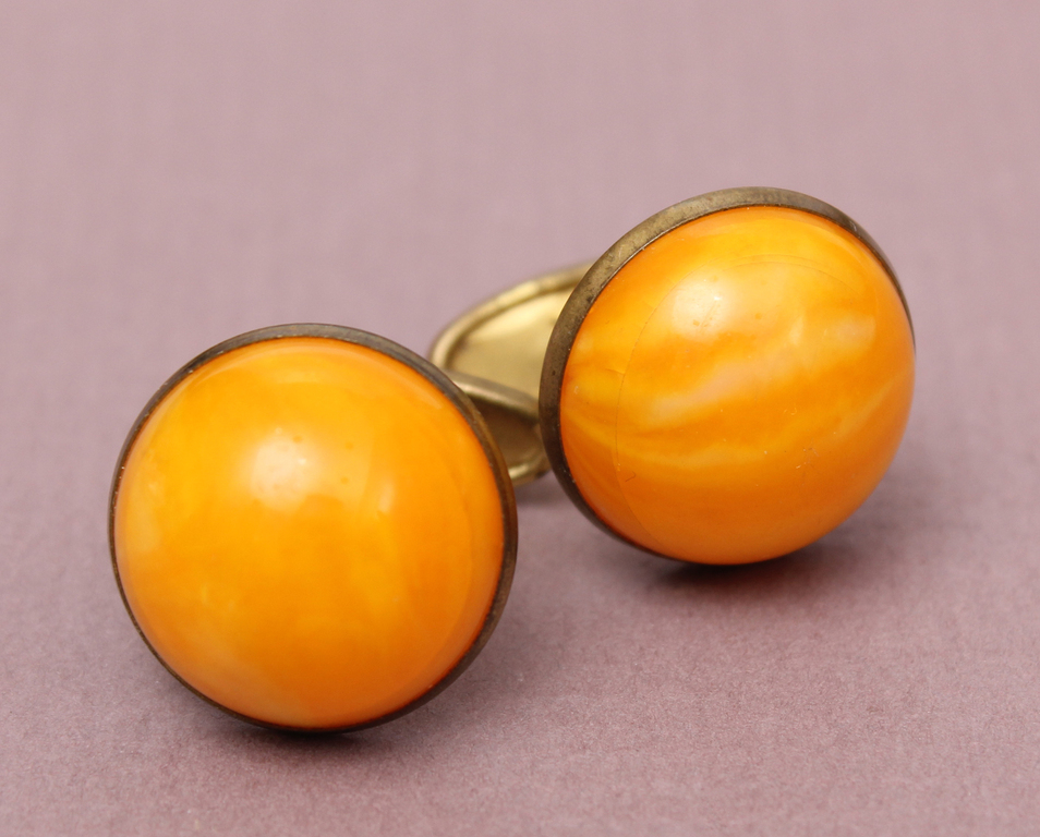 Metal cufflinks with amber imitation 
