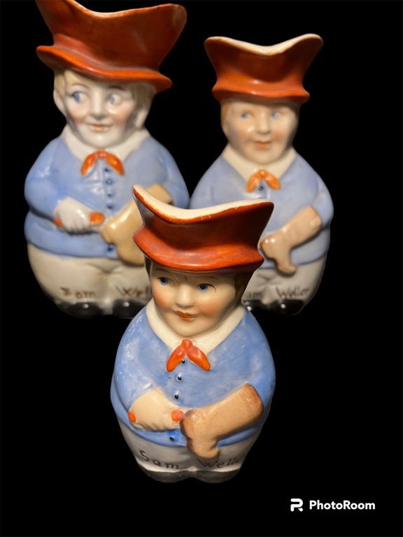 collection of porcelain teapots man with a red scarf in a red hat shoemaker with a boot sam weller carlz dickens short story hero