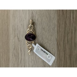 Gold brooch with natural amethyst