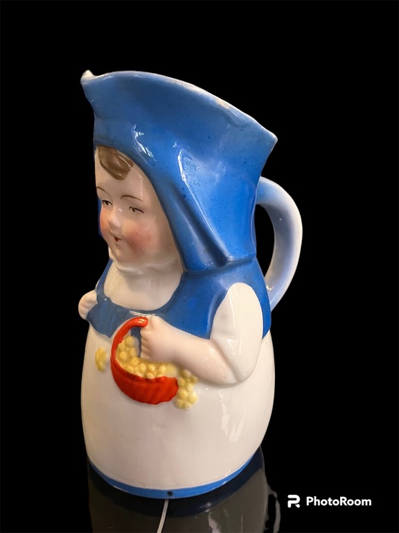 porcelain jug Annele in a blue hat with a beautiful fruit basket