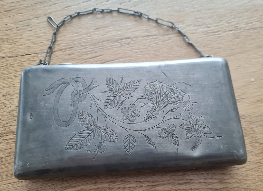 Silver bag with floral engraving. 1930s. 152 gr.
