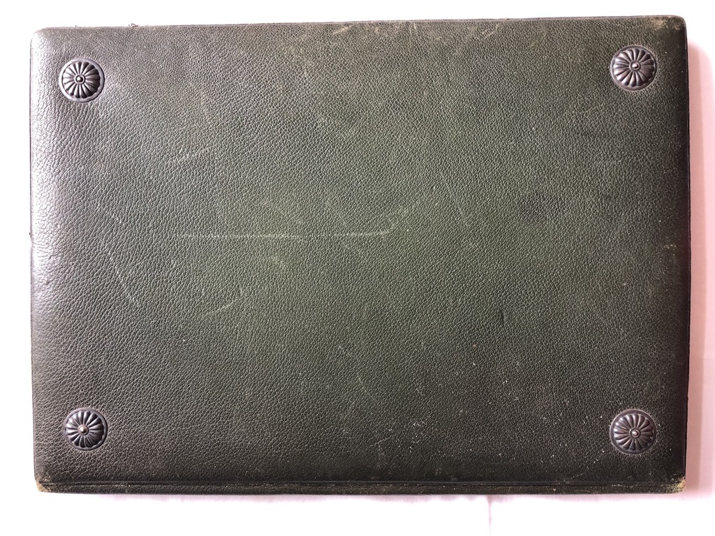 Leather covers with decorative metal studs for notes and documents