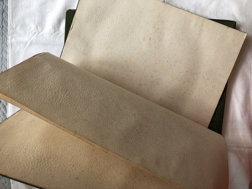 Leather covers with decorative metal studs for notes and documents