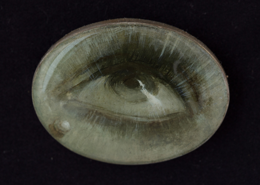 Silver brooch with an eye painting on the mother-of-pearl