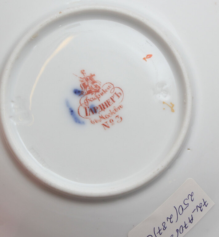 Hand painted porcelain cup with saucer