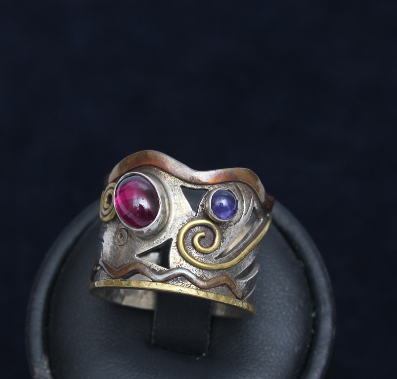 Silver ring with two colored stones