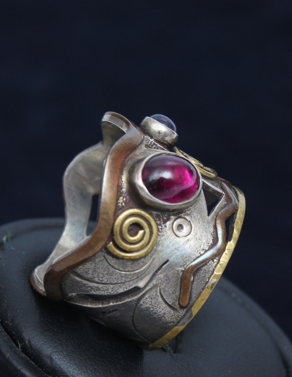 Silver ring with two colored stones