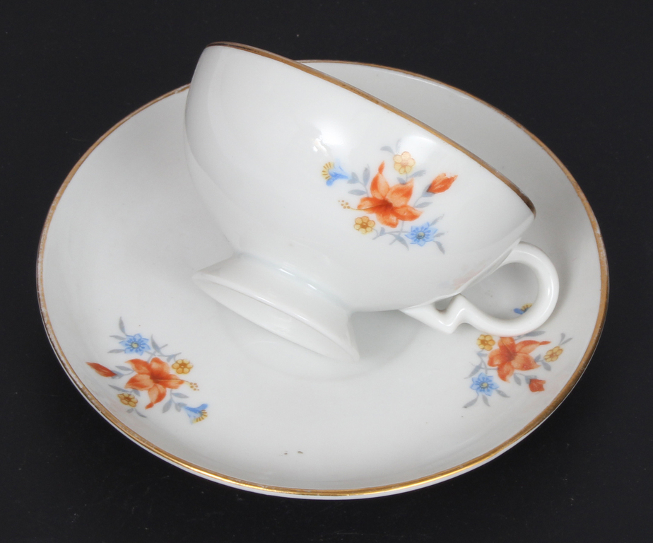 Painted porcelain cup with saucer