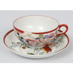 Painted porcelain cup with saucer