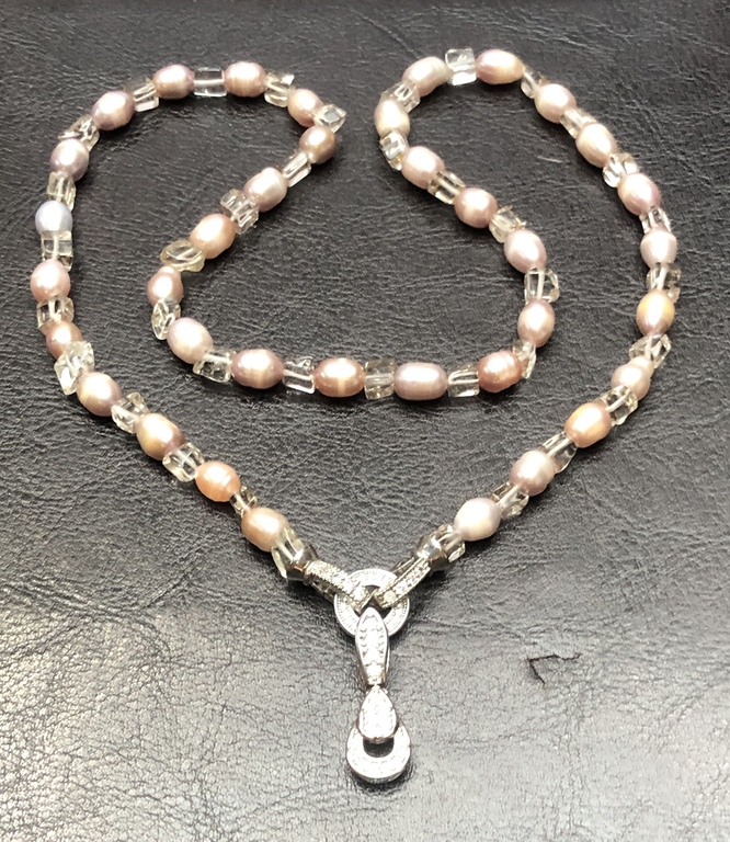 Pink Freshwater pearl beads with glass elements.