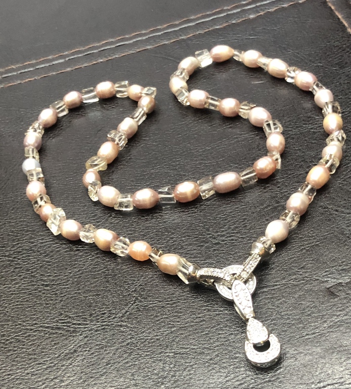 Pink Freshwater pearl beads with glass elements.