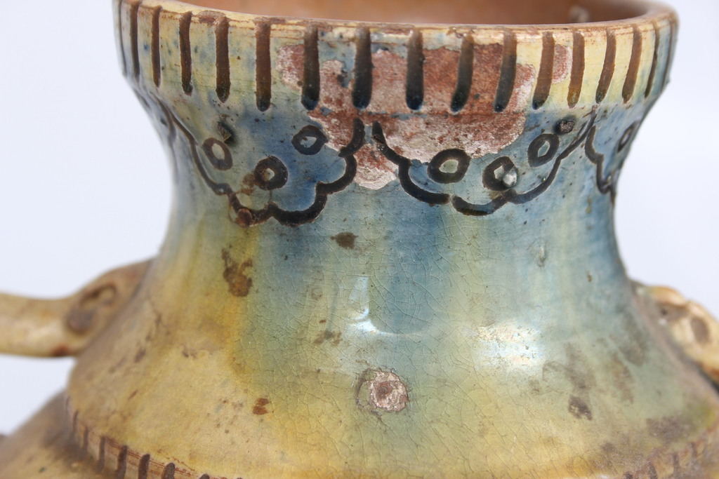 Ceramic vase with ornaments