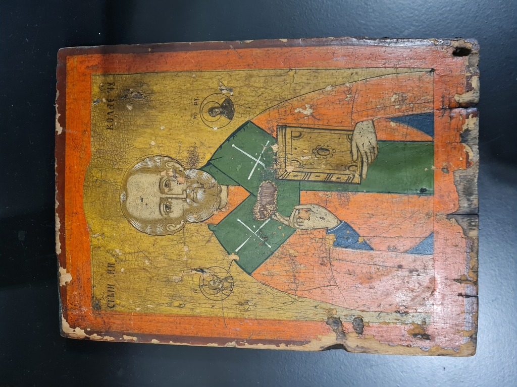 An ancient icon on a wooden base