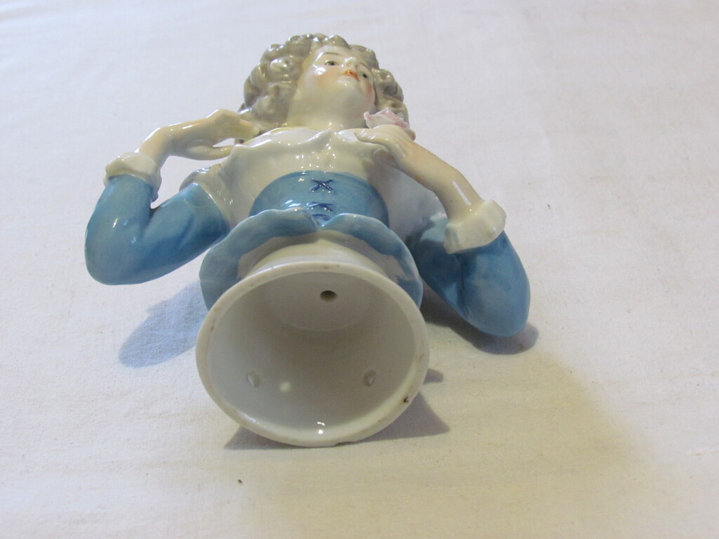 Porcelain figure from the warming cover of a kettle